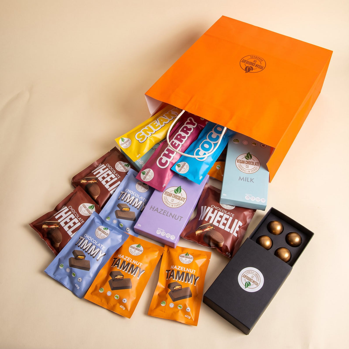 Gift bag spilling Wheelies, Timmys, Tammys, Coco, Cherry and a box of bon bons