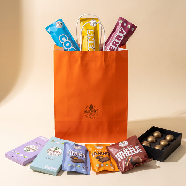 Gift Bag - One of Everything: the chocolates packed in the orange Vegan Chocolate Co gift bag