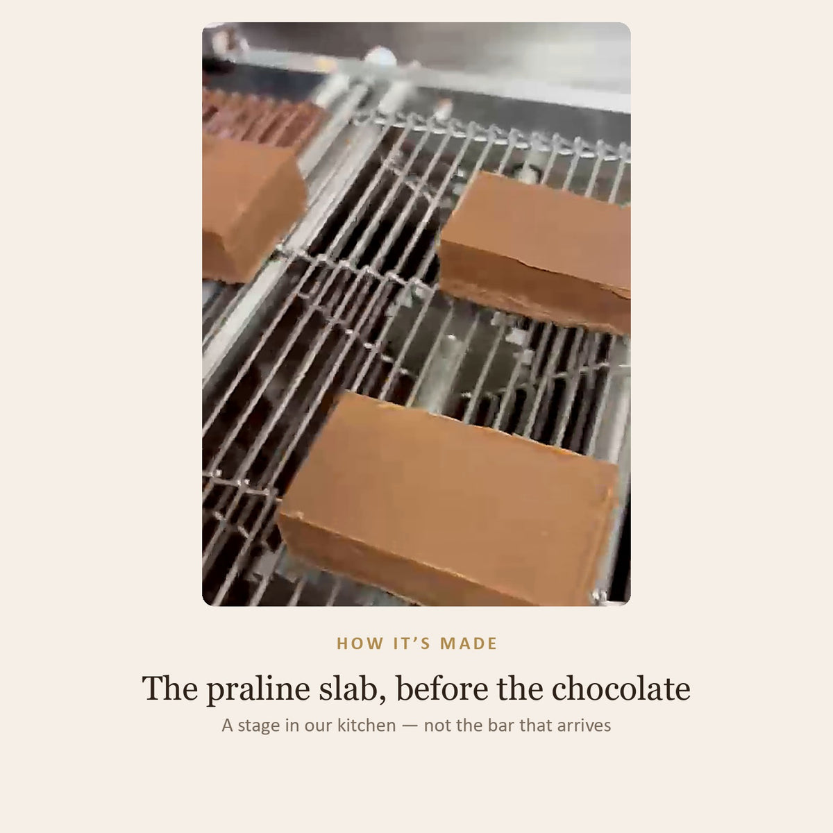 How it is made: slabs of almond praline on the enrobing line before the chocolate coating goes on — a stage in the kitchen, not the finished bar