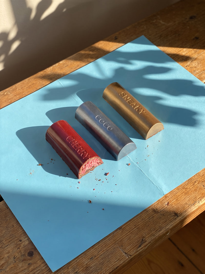 Cherry, Coco and Sneaky bars on blue paper